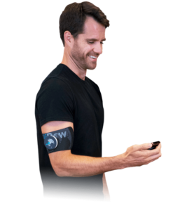 Guy holding a hidow tens ems unit