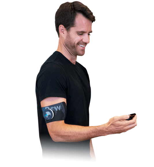 Guy holding a hidow tens ems unit
